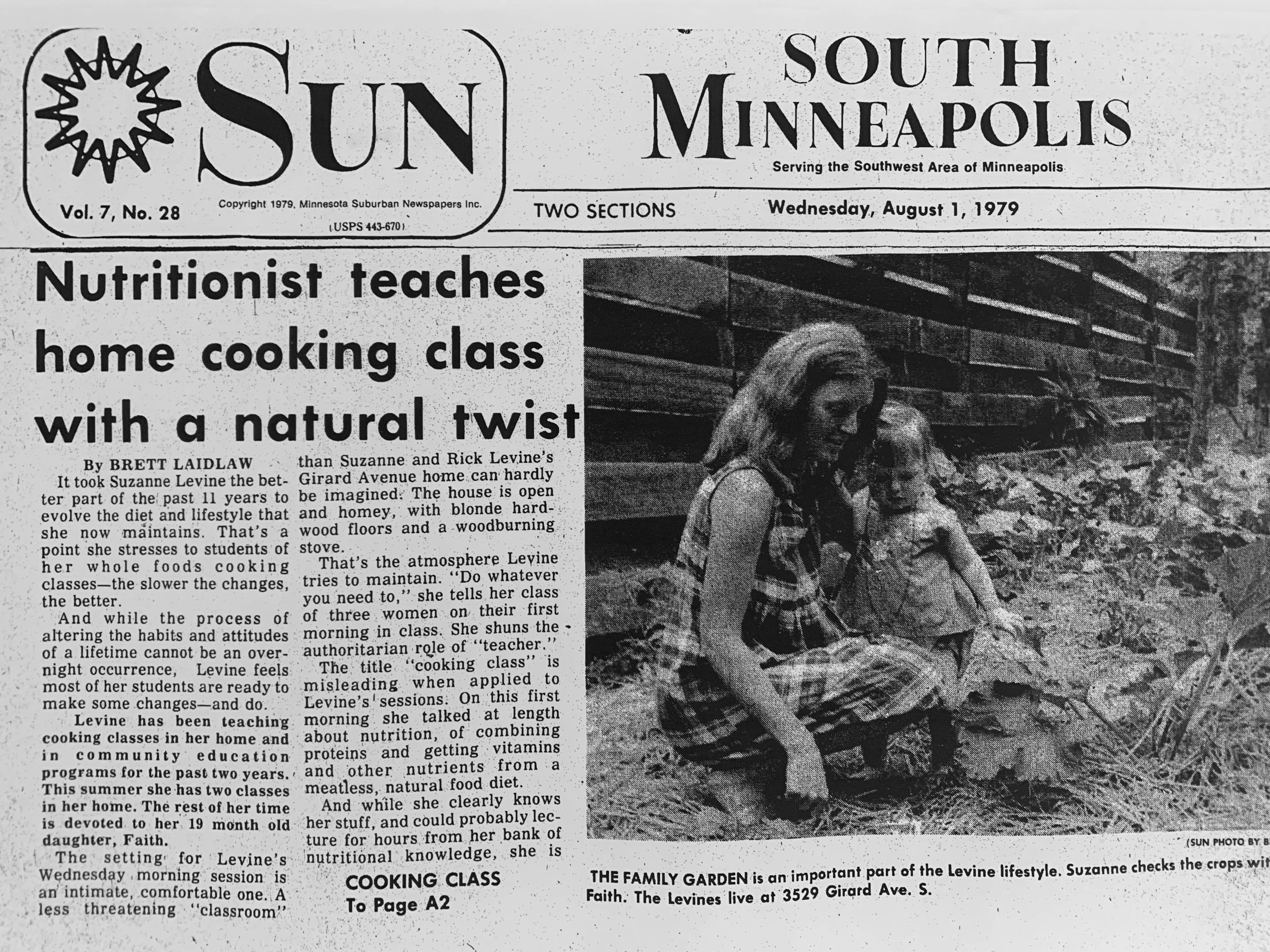The front page of the South Minneapolis Sun from Wednesday, August 1, 1979. There is an article about Suzanne with the headline, "Nutritionist teaches home cooking class with a natural twist." A photo of Suzanne and Faythe as a baby in their garden is featured. 